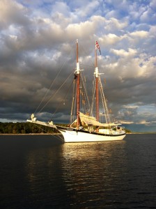 Manitou sits at anchor in a tranquil harbor at day's end.